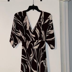 Ladies dress, Size: XL. Brown and White print. V-neck front and back.